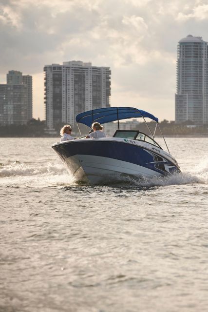 1 hour Miami Private Boat Ride with champagne and captain - Onboard Comfort: Music, BYOB Cooler, Ponchos, and Optional Champagne