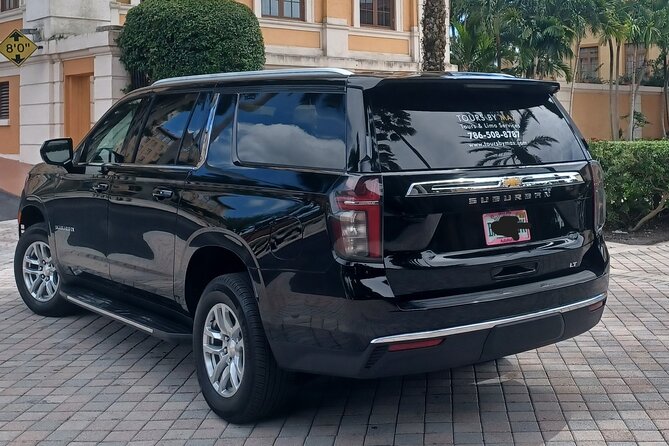 MIA airport and Port of Miami luxury private transfers - The Pickup Moment: Name Sign at MIA and Port of Miami