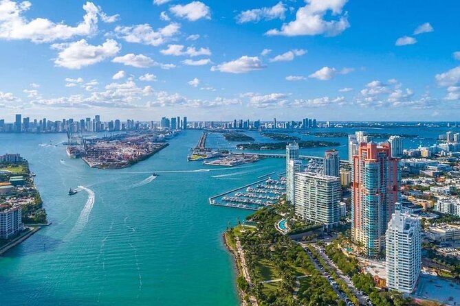 Miami Airplane Tour: South Beach, Islands, Downtown Skyline - Fisher Island, South Pointe Park, and the beach-meets-privacy contrast