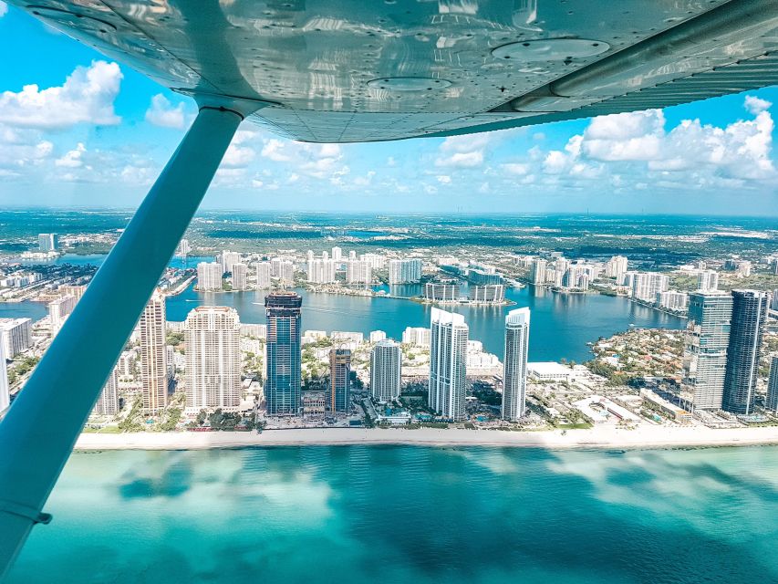 Miami Beach: South Beach Private Airplane Tour with Drinks - Fisher Island and the Miami coastline photo line
