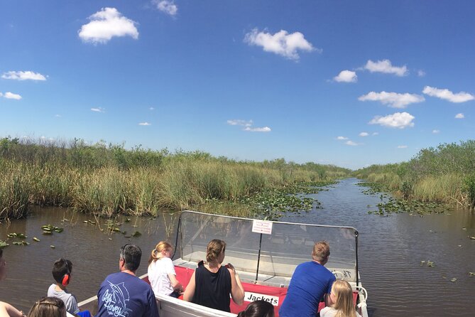Miami: Everglades Airboat incl. Group Photo - Getting on a covered airboat: speed, turns, and photo moments