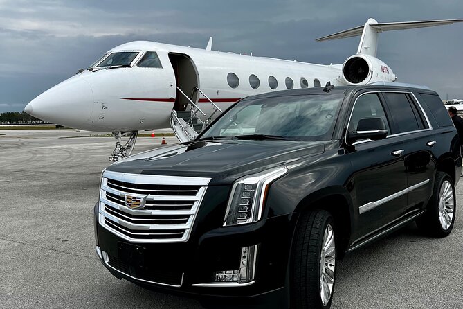 Private SUV Limo Services in Miami FL - Miami Traffic Meets a Black-on-Black Cadillac Escalade Platinum