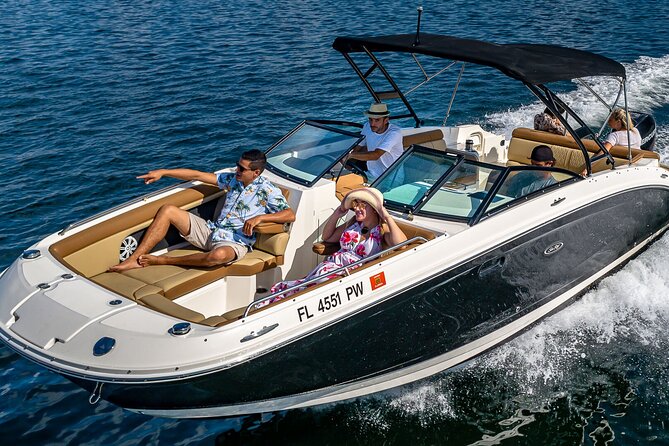 Top-Rated Boat Rental with Captain | 1 to 11 People - Bayside Marketplace and Skyviews Miami Ferris Wheel from the waterline
